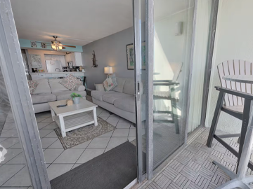 Comfortable living room with ocean views through large sliding glass doors