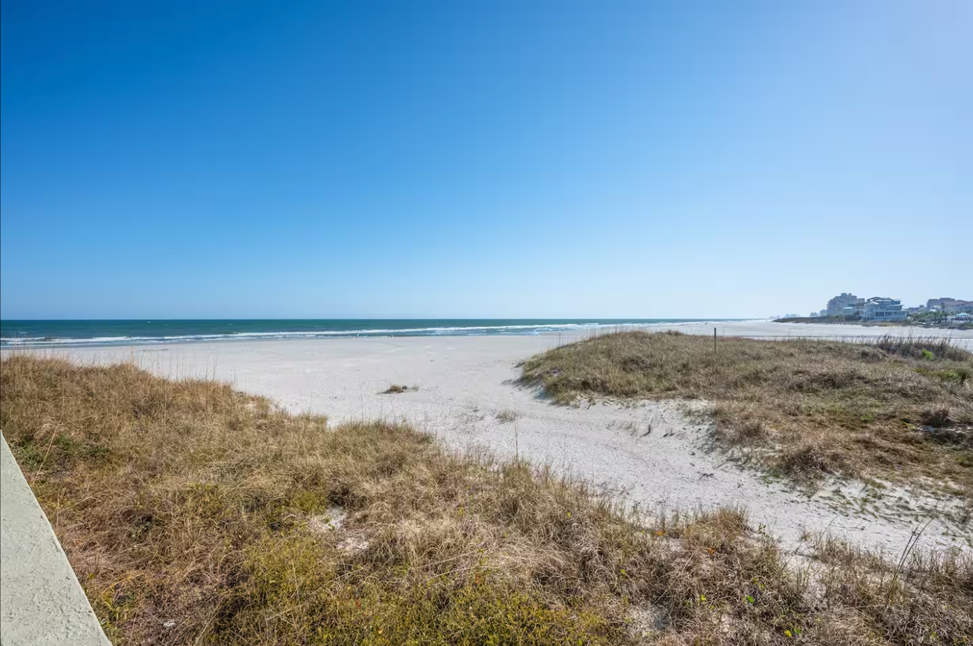 Beautiful view of the quiet Shore Drive beach with dunes and ocean