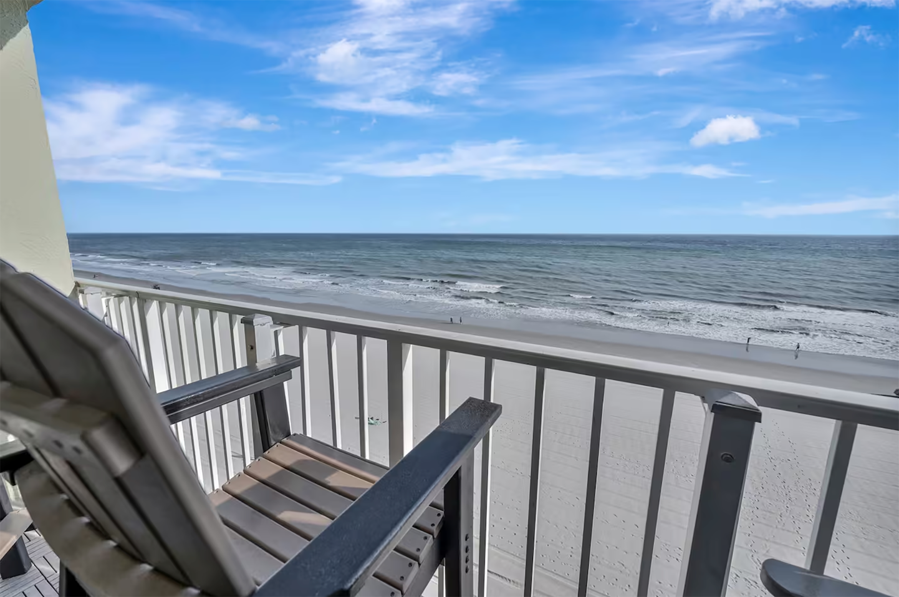 Direct oceanfront view from the private balcony at Ocean's Lullaby